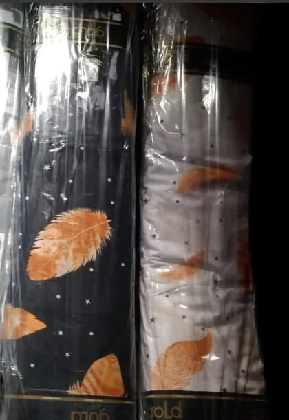 Ткань для постельного белья Бязь "Gold" Lux  "Перья (черный, оранжевые)" GL1242 (A+B) - (50м+50м)